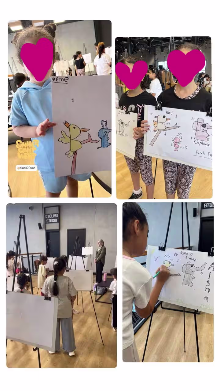 Children in an art class display drawings of birds and elephants on paper with easels in a studio.
